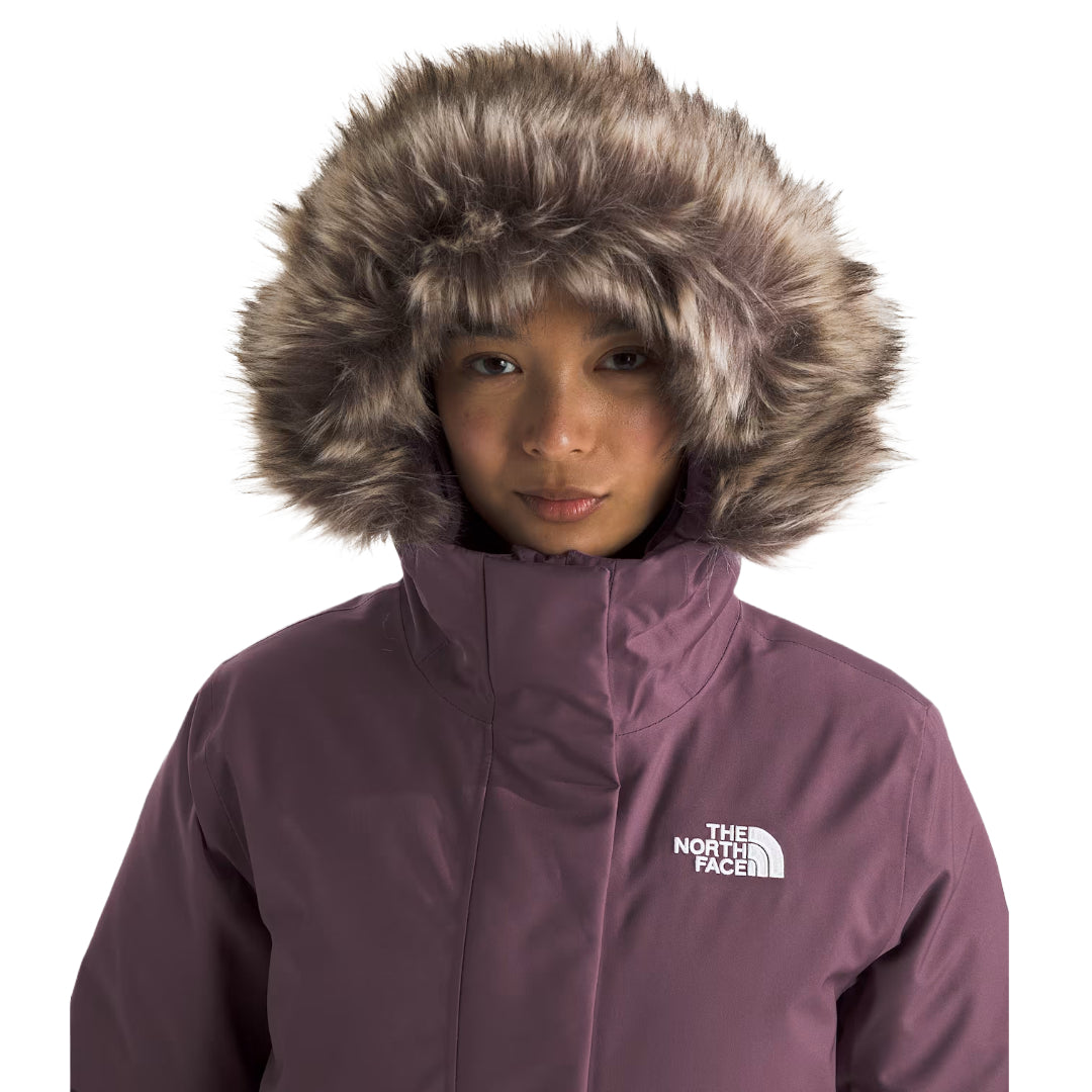 "The North Face Women's ARC Parka, lightweight waterproof jacket with a modern design, providing protection from rain and wind