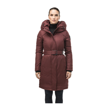 Women's thigh-length winter parka with an oversized hood, tailored silhouette, long sleeves, fleece-lined pockets, and a sleek insulated design