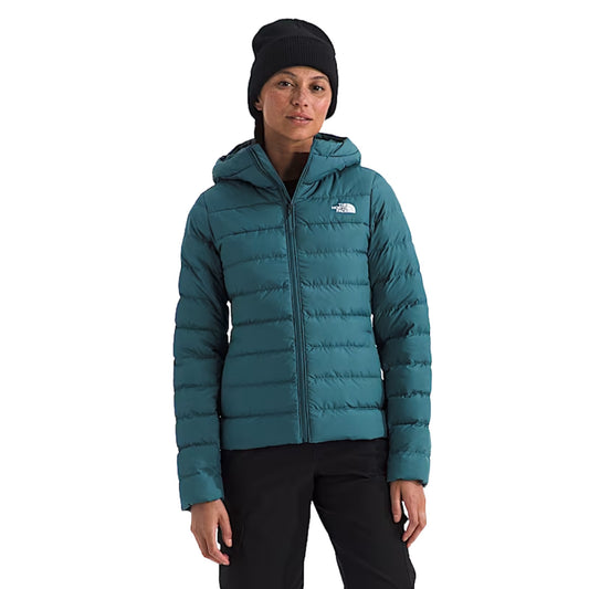 The North Face Women’s Aconcagua 3 Hoodie in black, featuring a quilted design, full front zip, and fitted hood for warmth and comfort.