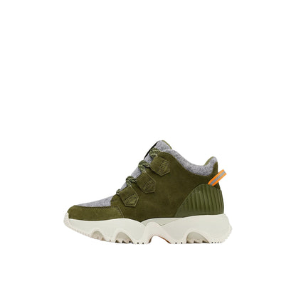 A pair of women’s KINETIC™ Impact Caribou Plus Waterproof Boots in premium leather and suede with a bold scalloped rubber sole, lace-up front, and modern winter-ready design.