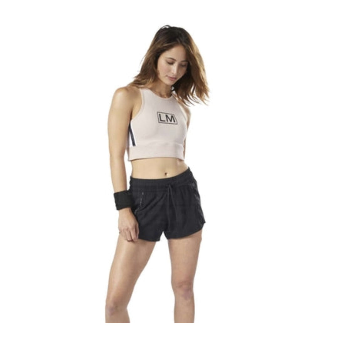 Women’s athletic tank top featuring a slim-fit silhouette, sleeveless design, lightweight moisture-wicking fabric, and breathable construction for training and fitness activities