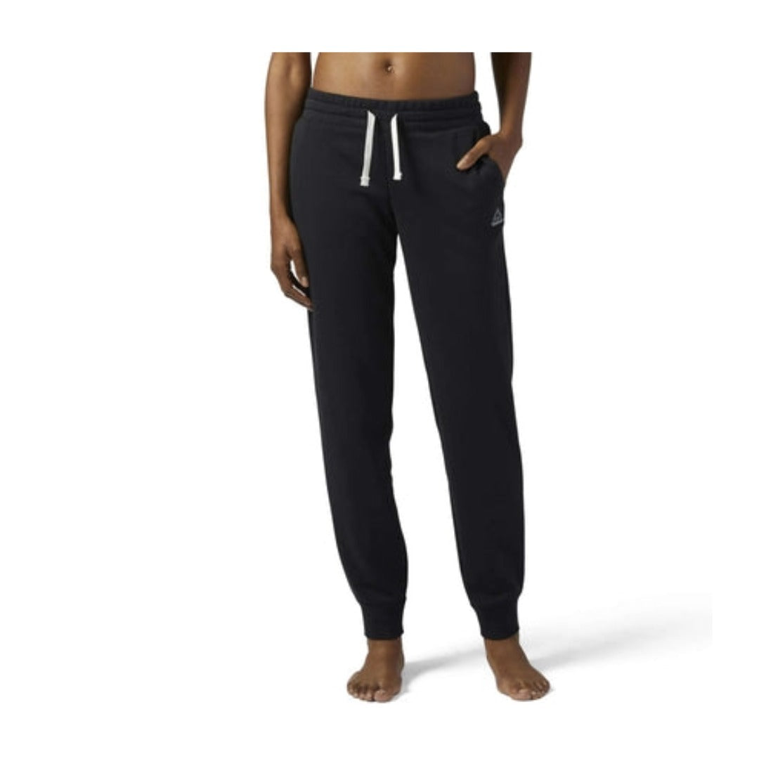 Women’s jogger pants featuring soft French terry fabric, an elastic drawstring waistband, side pockets, ribbed ankle cuffs, and a relaxed tapered fit for everyday comfort