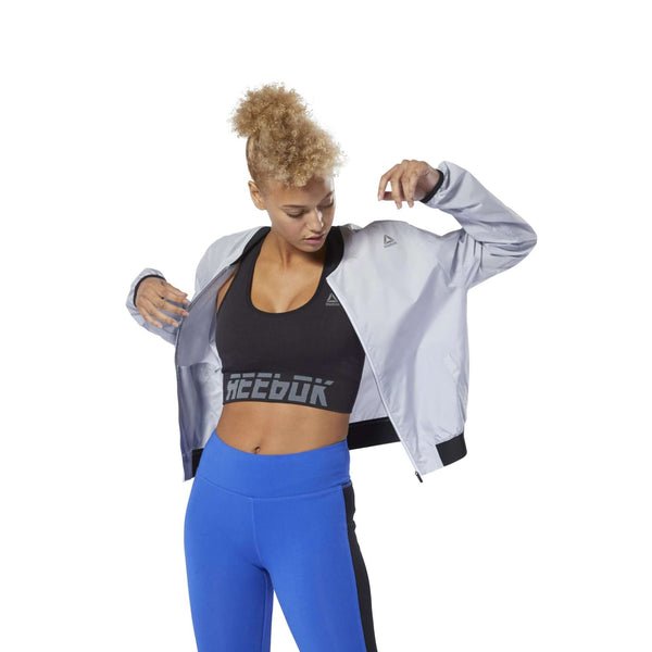 Women’s seamless padded sports bra featuring a stretchy performance fabric, removable cups, supportive underband, and smooth design for workouts and everyday comfort