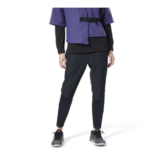 Women’s thermal pants featuring a soft insulating fabric, elastic waistband, tapered-leg design, side pockets, and a comfortable fit for cold-weather activities and everyday wear