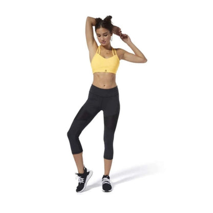 Women’s 3/4-length workout tights featuring stretch moisture-wicking fabric, breathable mesh panel detailing, a supportive high-rise waistband, and a fitted athletic silhouette for training and fitness activities