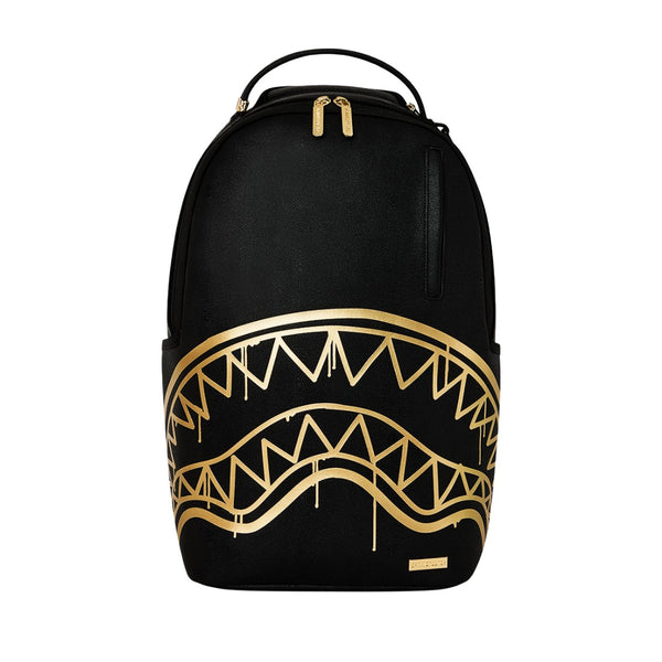 Sprayground Gold Fang Backpack with shark-mouth graphic, gold fangs, and multiple zippered compartments.