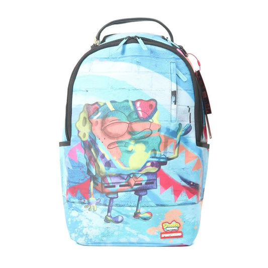 SPRAYGROUND Peanuts Joe Cool Reveal Checker DLXSV Backpack with Snoopy Joe Cool graphic on black-and-white checkerboard pattern and red SPRAYGROUND logo.