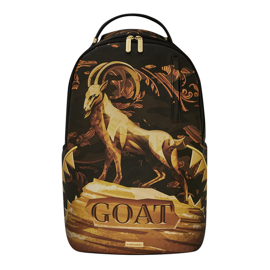 SPRAYGROUND G.O.A.T. DLXSV Backpack featuring a detailed goat graphic with gold accents and shark mouth design on durable vegan leather









