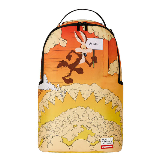 Sprayground DLXR Backpack featuring Looney Tunes’ Wile E. Coyote falling through smoke on a cartoon cliff backdrop, accented with gold zippers and multiple storage compartments.