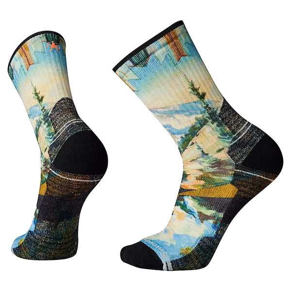 Hiking crew socks featuring light cushioned merino wool construction, breathable trail comfort, and mountain-inspired printed styling for outdoor adventures