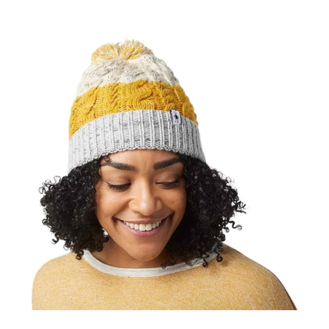 Retro-inspired knit beanie featuring a soft merino wool blend construction, fold-over cuff, and cozy cold-weather styling for outdoor and everyday wear