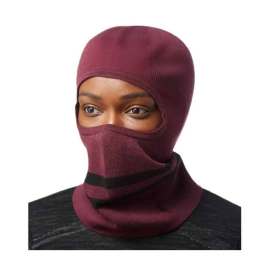 Smartwool Intraknit Merino Tech balaclava covering head and face, featuring breathable knit zones and snug fit, designed for cold-weather outdoor performance