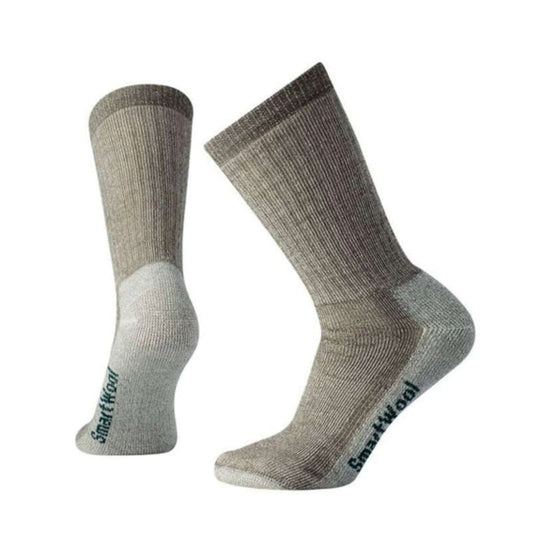 Women’s medium-cushioned crew hiking socks featuring breathable merino wool construction, supportive trail comfort, and durable outdoor styling for hiking adventures