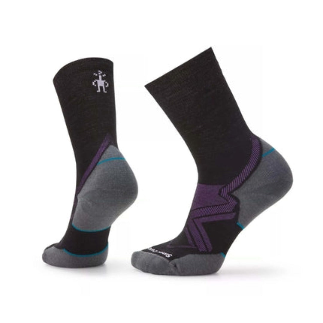 Women’s cold-weather running crew socks featuring merino wool construction, targeted cushioned comfort, and breathable athletic styling for winter training and outdoor activity