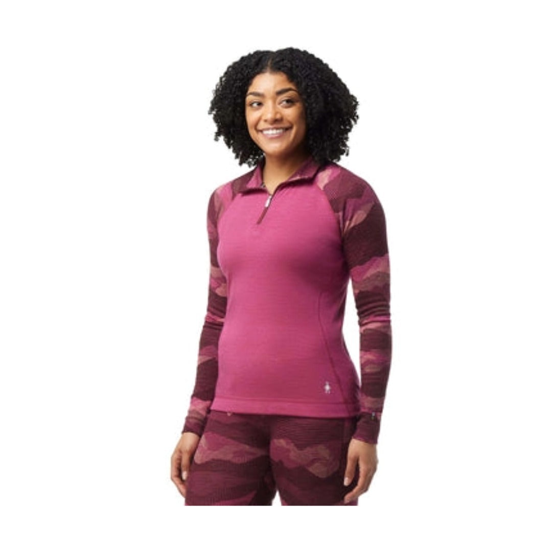 Women’s merino wool thermal base layer featuring patterned styling, quarter-zip ventilation, and breathable cold-weather performance comfort for outdoor activities