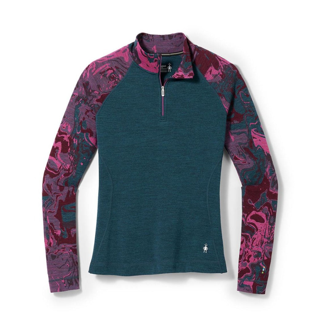 Women’s patterned merino wool thermal base layer featuring a quarter-zip collar, breathable warmth, moisture-wicking comfort, and midweight cold-weather performance