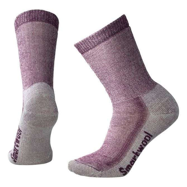 Women’s medium-cushioned crew hiking socks featuring breathable merino wool construction, supportive trail comfort, and durable outdoor styling for hiking adventures