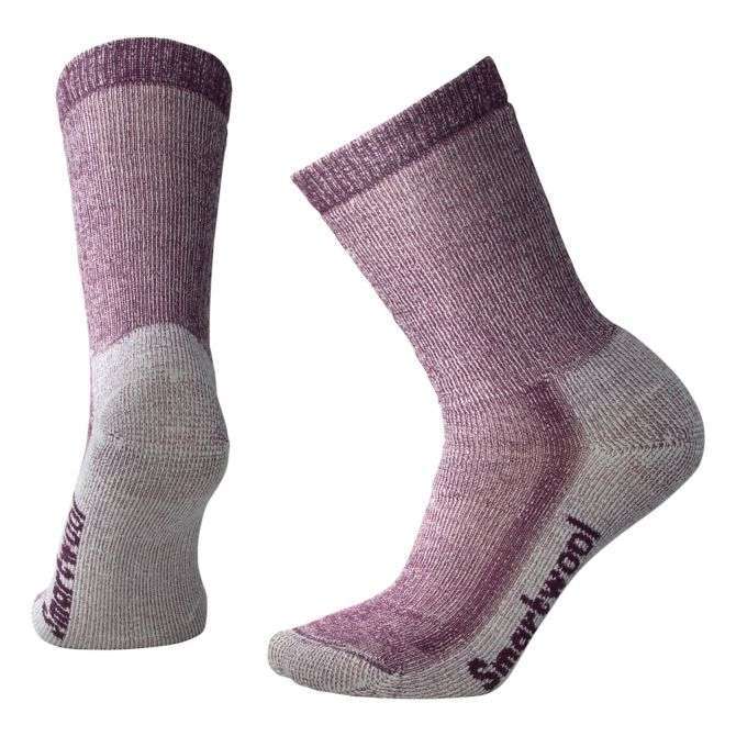 Women’s medium-cushioned crew hiking socks featuring breathable merino wool construction, supportive trail comfort, and durable outdoor styling for hiking adventures