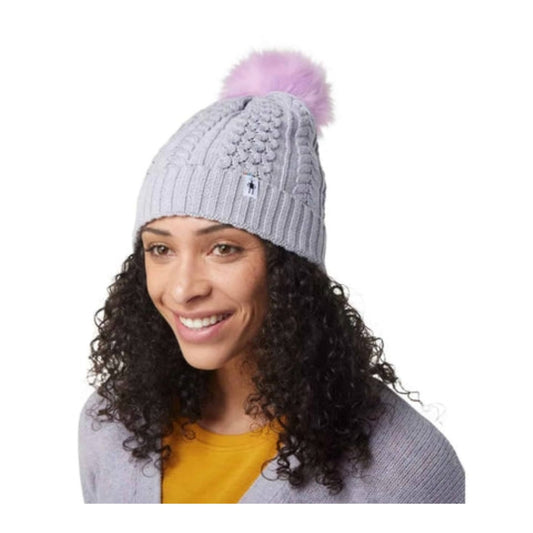 Women’s knit winter beanie featuring a soft merino wool blend construction, fold-over cuff, and classic cold-weather styling for everyday outdoor wear