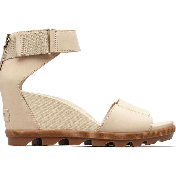 Women's leather ankle-strap wedge sandals with a cushioned footbed, elevated platform, adjustable strap, and molded rubber outsole