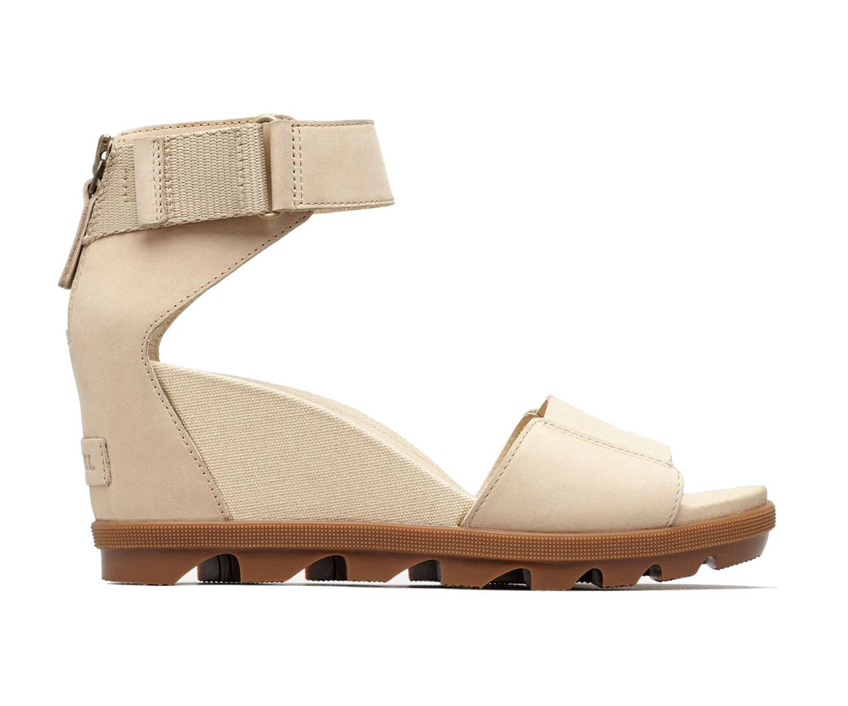 Women's leather ankle-strap wedge sandals with a cushioned footbed, elevated platform, adjustable strap, and molded rubber outsole