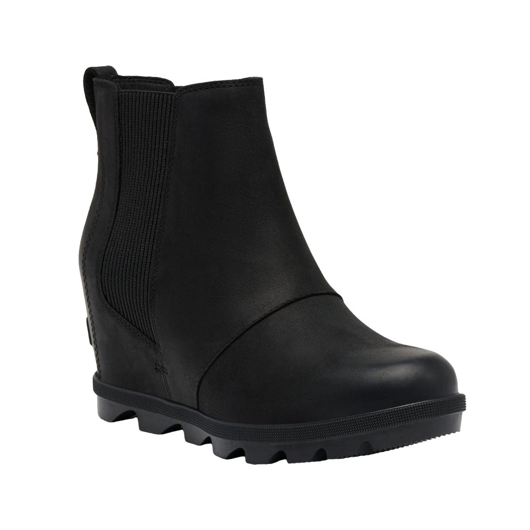 Women’s Chelsea wedge ankle boots featuring a sleek leather and textile upper, elastic side panels, rear pull tab, cushioned footbed, supportive wedge sole, and durable rubber outsole for stylish everyday wear