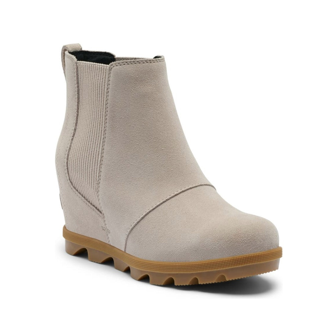 Women’s Chelsea wedge ankle boots featuring a sleek leather and textile upper, elastic side panels, rear pull tab, cushioned footbed, supportive wedge sole, and durable rubber outsole for stylish everyday wear