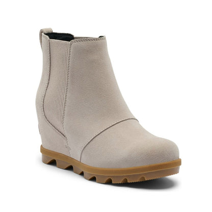 Women’s Chelsea wedge ankle boots featuring a sleek leather and textile upper, elastic side panels, rear pull tab, cushioned footbed, supportive wedge sole, and durable rubber outsole for stylish everyday wear