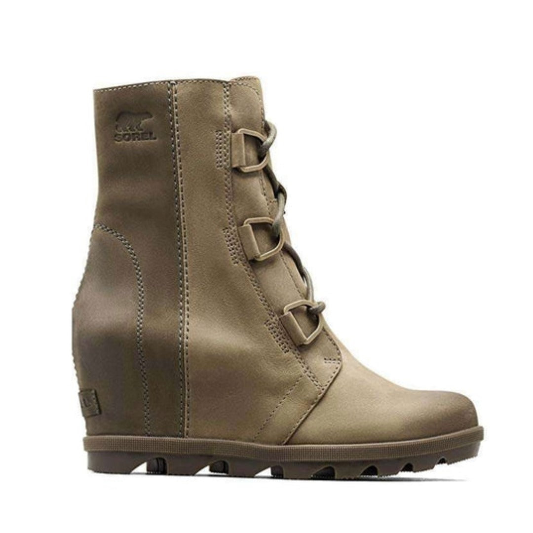 Women’s waterproof wedge boots featuring a full-grain leather upper, lace-up closure, elevated 3-inch wedge, cushioned removable footbed, and molded rubber outsole.