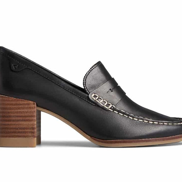 Women’s leather penny loafers with a low stacked heel, featuring a classic slip-on design and polished finish, styled for both office and casual wear