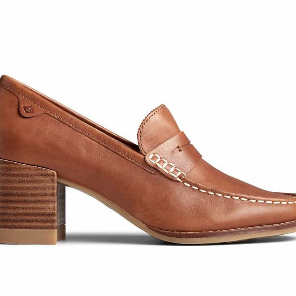 Women’s leather penny loafers with a low stacked heel, featuring a classic slip-on design and polished finish, styled for both office and casual wear