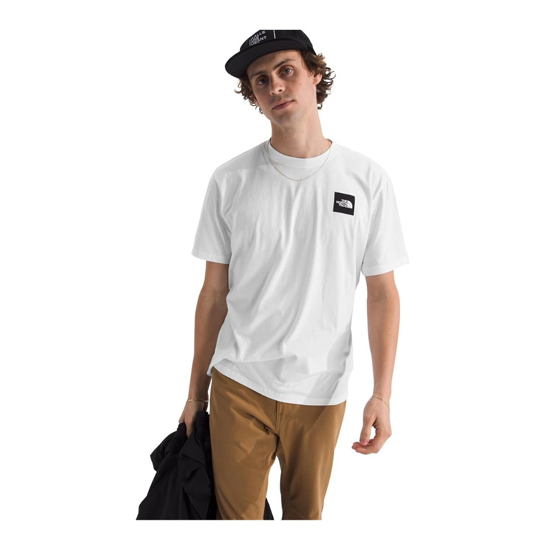 The North Face Men’s Short-Sleeve Brand Proud Tee with crewneck design and bold logo graphic on the front, made from soft breathable fabric.