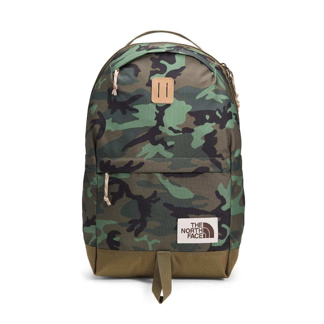 The North Face daypack backpack in Thyme Brushwood camo print with Military Olive and Kelp Tan accents, featuring a classic design and front zip pocket.