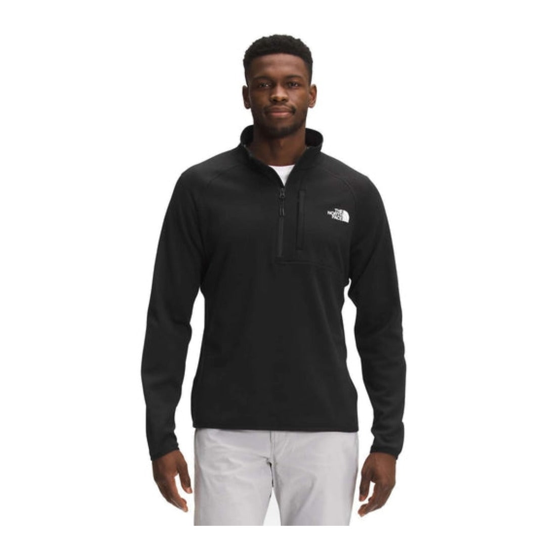 The North Face Men’s Canyonlands 1/2 Zip fleece pullover with half-zip collar, chest pocket, and stretch midweight fleece fabric.