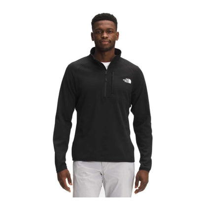 The North Face Men’s Canyonlands 1/2 Zip fleece pullover with half-zip collar, chest pocket, and stretch midweight fleece fabric.