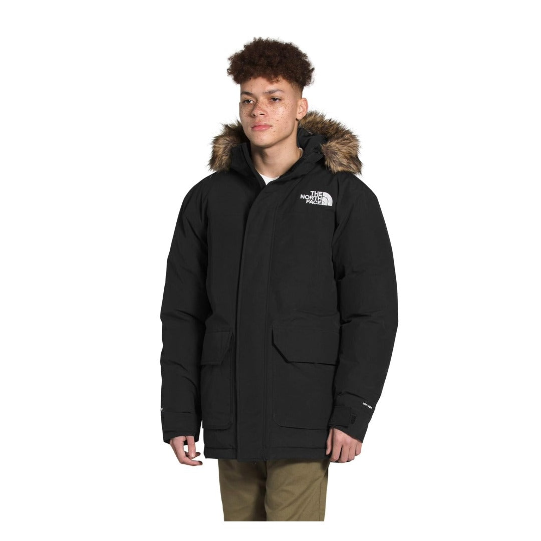 THE NORTH FACE men’s McMurdo Parka in a long insulated parka design with hood and multiple pockets, providing waterproof, windproof protection and winter warmth.