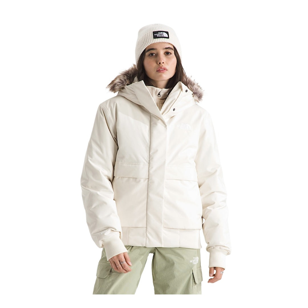 Women's insulated bomber jacket with a durable outer shell, cozy hood, ribbed cuffs and hem, full front zipper, and multiple pockets for cold-weather wear.