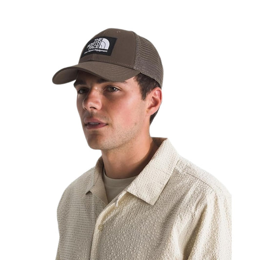 The North Face Unisex Mudder Trucker Baseball Cap with structured front, mesh back panels, and adjustable snapback closure.