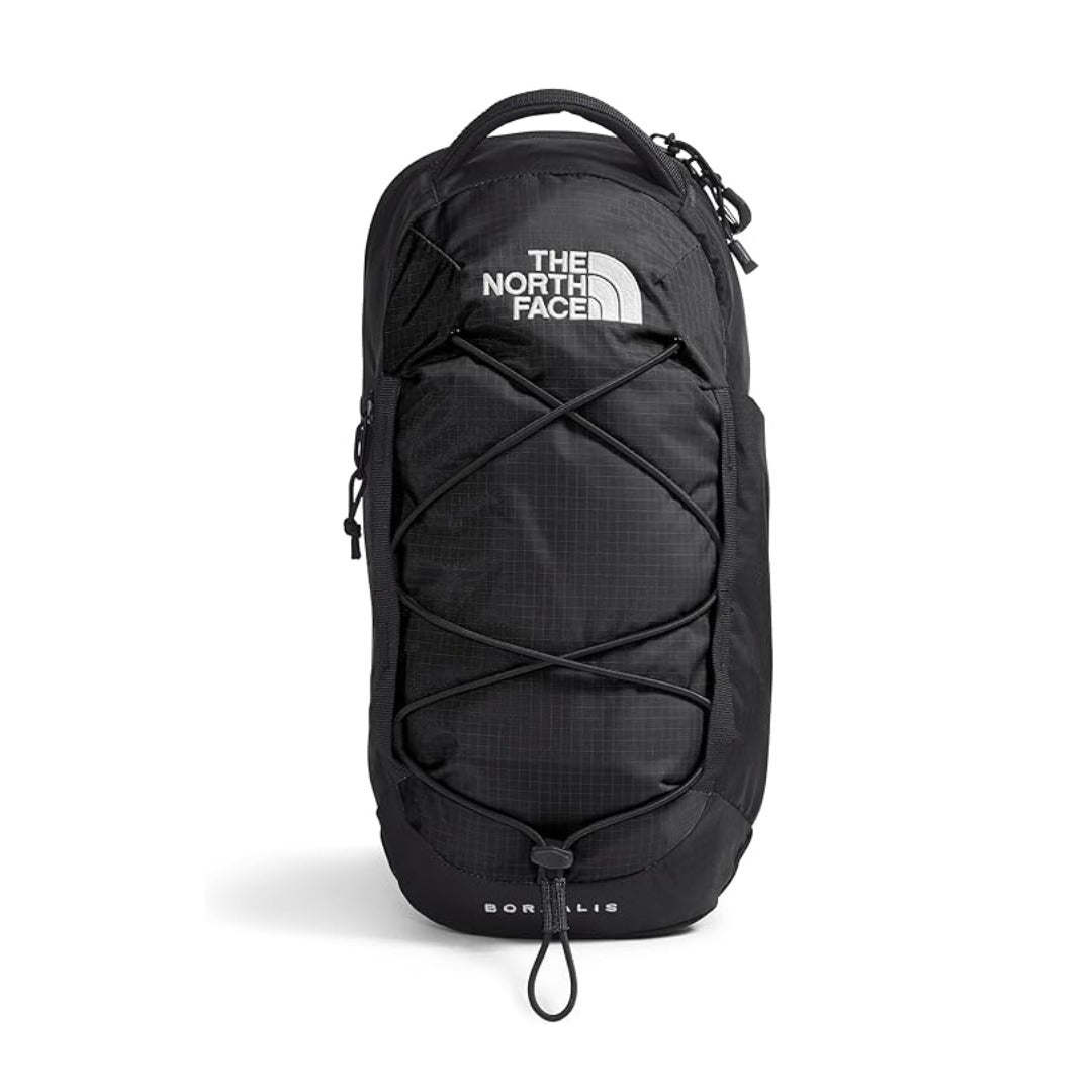 Compact Borealis sling bag with adjustable shoulder strap and zippered compartments, designed for everyday carry and travel.