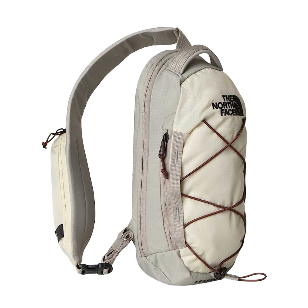 The North Face Borealis Sling bag with adjustable strap, padded back panel, and multiple zip compartments for compact everyday carry.