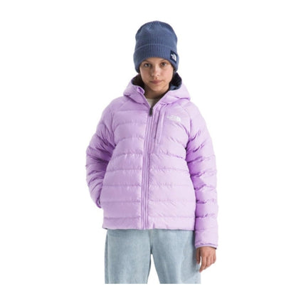 Girl wearing a reversible North Face insulated jacket, showing a full-zip front and cozy design suitable for cool outdoor conditions.