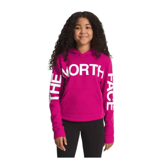 The North Face Girls’ Camp Fleece Pullover Hoodie with soft fleece fabric, attached hood, kangaroo pocket, and ribbed cuffs.