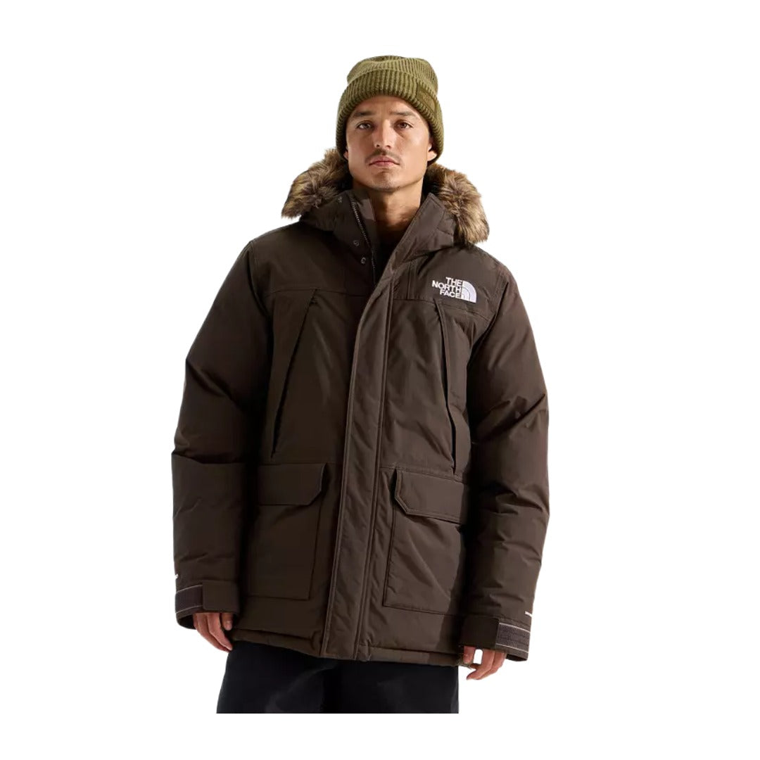 Men’s long winter parka featuring a waterproof-breathable outer shell, warm insulation, adjustable hood with faux-fur trim, full-length zipper with storm flap, multiple pockets, and adjustable cuffs for cold-weather protection