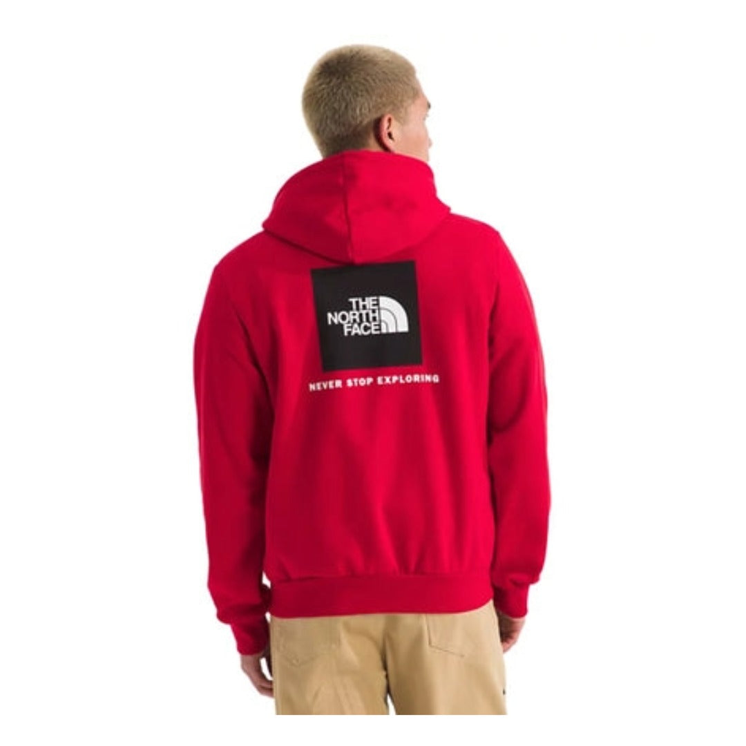 The North Face Men’s Evolution Box Hoodie in black with front logo on chest and large white “Never Stop Exploring” graphic on the back.
