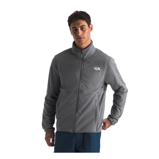 Man wearing a North Face Glacier fleece jacket with a full-zip front and stand collar, designed for lightweight warmth and casual outdoor wear.