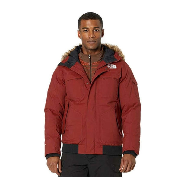 Men wearing The North Face Gotham Jacket III, a black insulated waterproof winter parka with hood for cold weather.