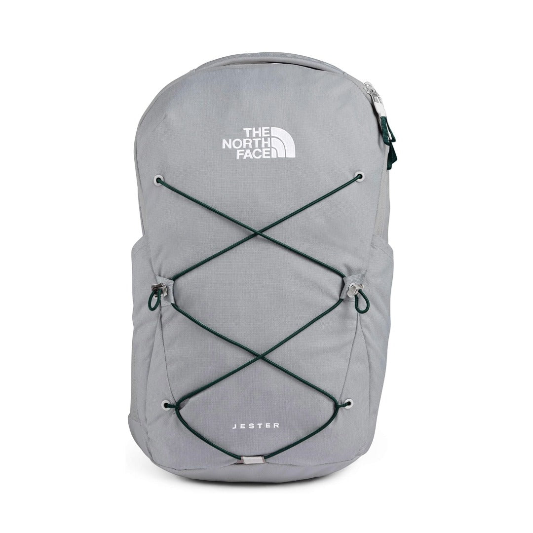 The North Face Jester backpack featuring a classic design with padded shoulder straps, front organizational pocket, and dual water bottle pockets for everyday school and travel use.
