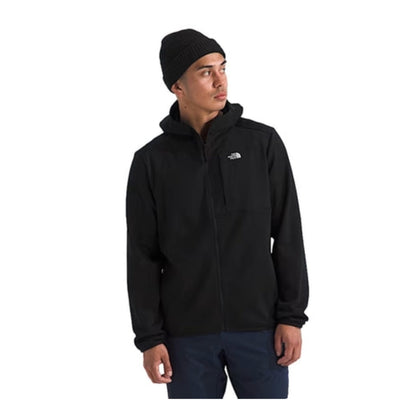Person wearing a North Face full-zip fleece hoodie, showcasing a soft fabric, front zipper, and hood in a casual outdoor setting.