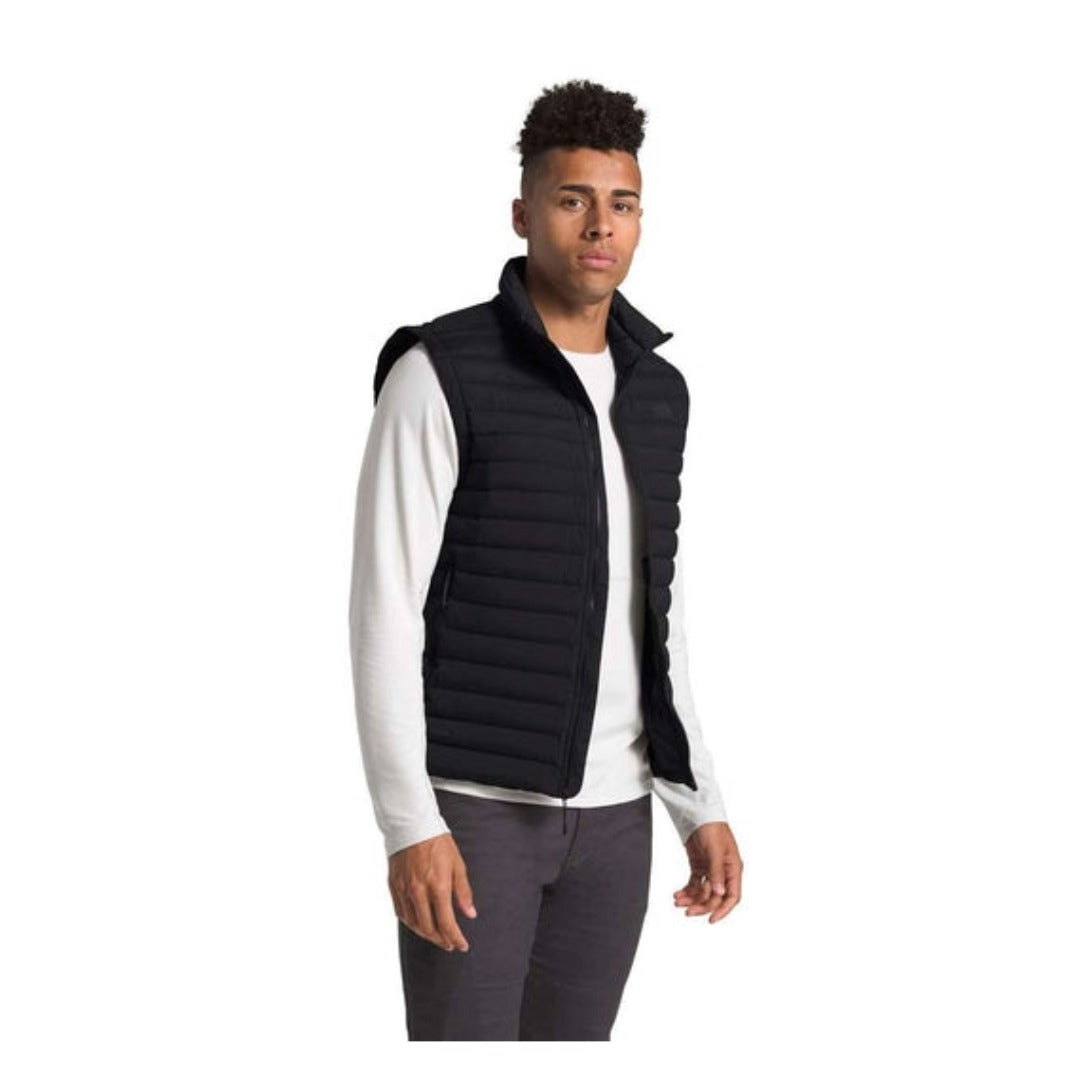 The North Face men’s Stretch Down insulated vest with stretch fabric and full-zip design, providing lightweight warmth and flexible layering for cold-weather activities.