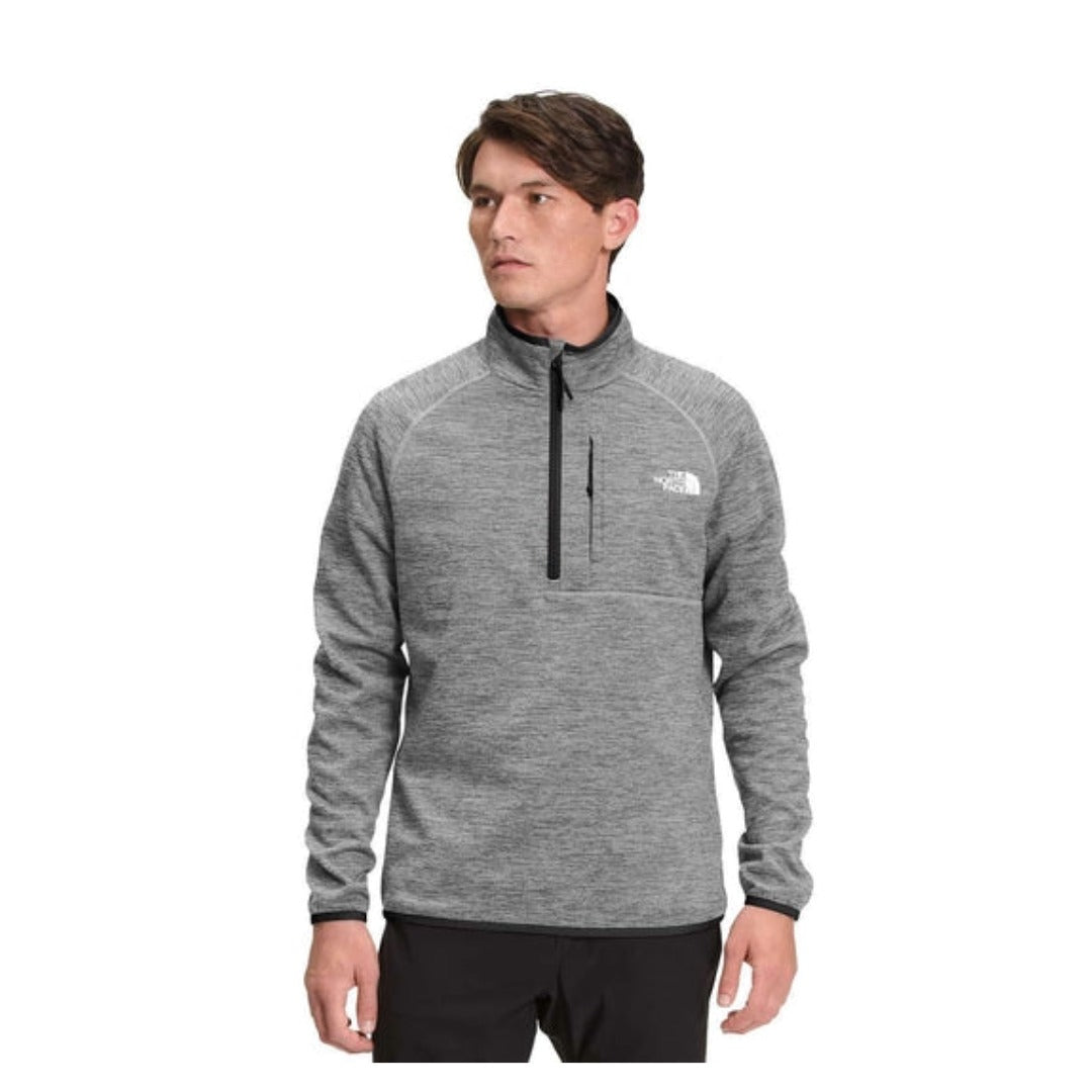 The North Face Men’s Canyonlands 1/2 Zip fleece pullover with half-zip collar, chest pocket, and stretch midweight fleece fabric.